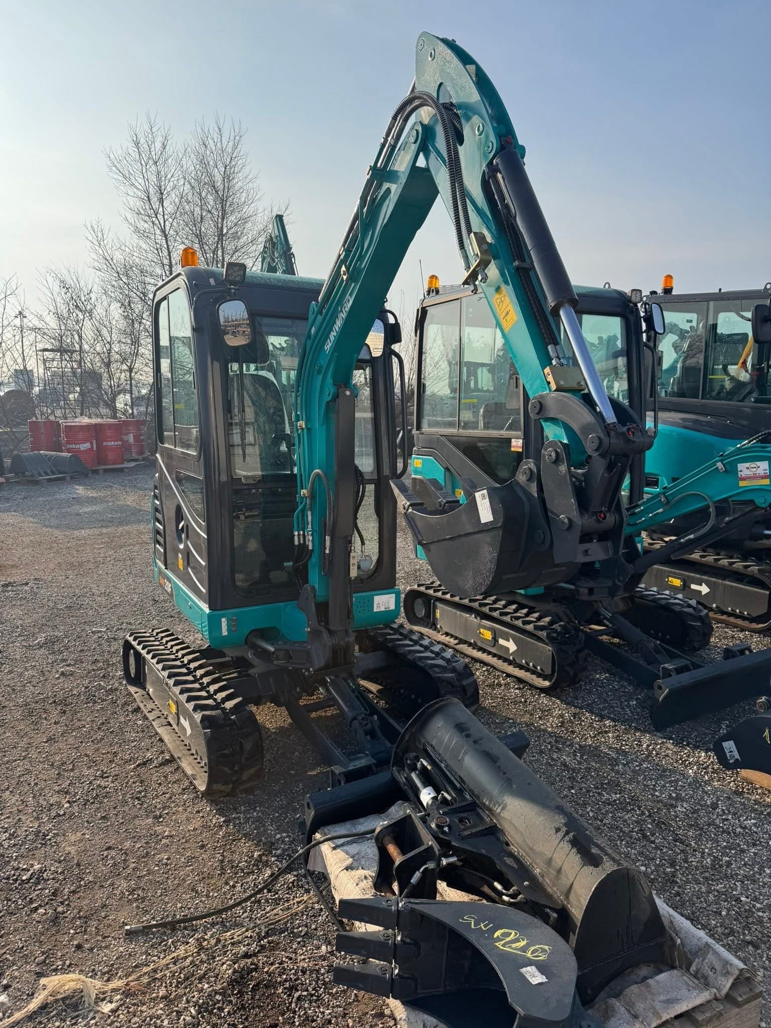 SCHNELL GARTEN BAU excavator on site